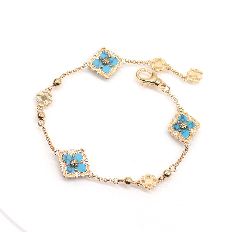 Pulsera de Flores con Nácar y Piedras Sintéticas - Baño de Oro 18K